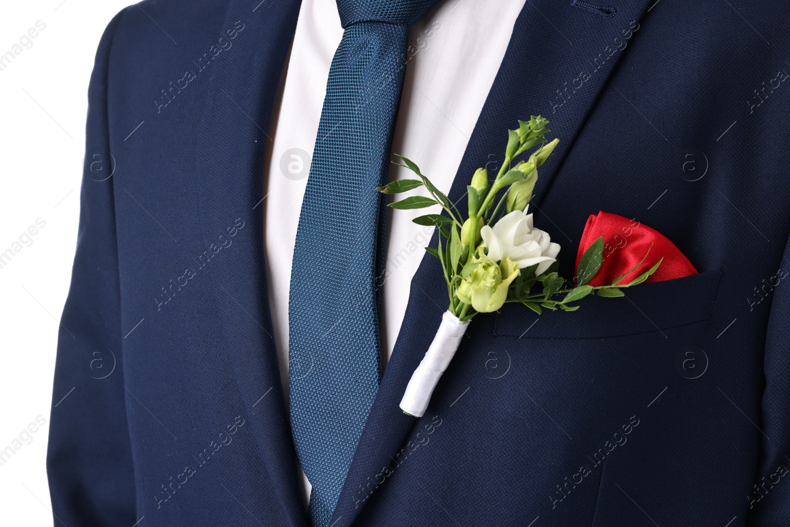 Photo of Groom in suit with stylish boutonniere on white background, closeup