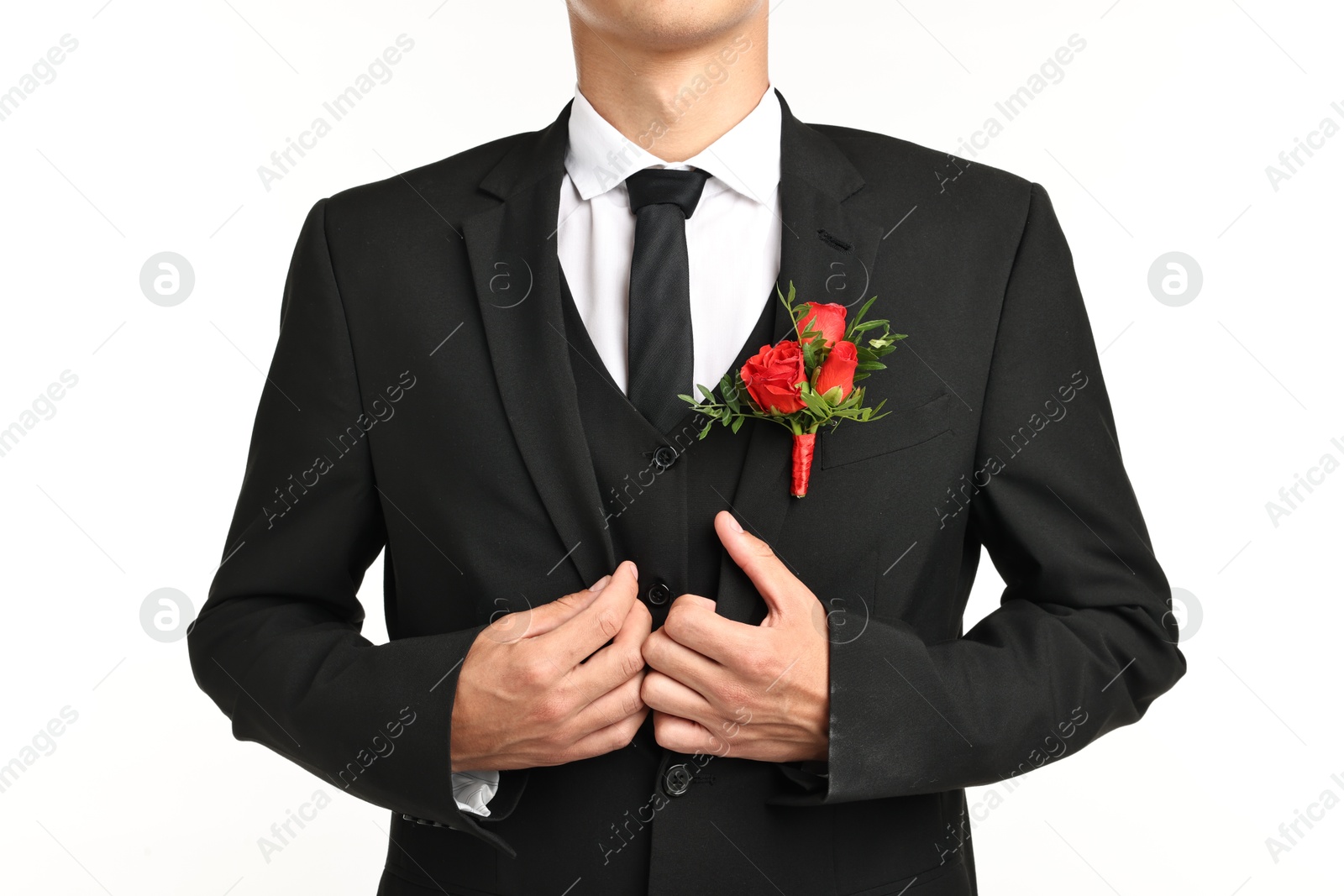 Photo of Groom in suit with stylish boutonniere on white background, closeup