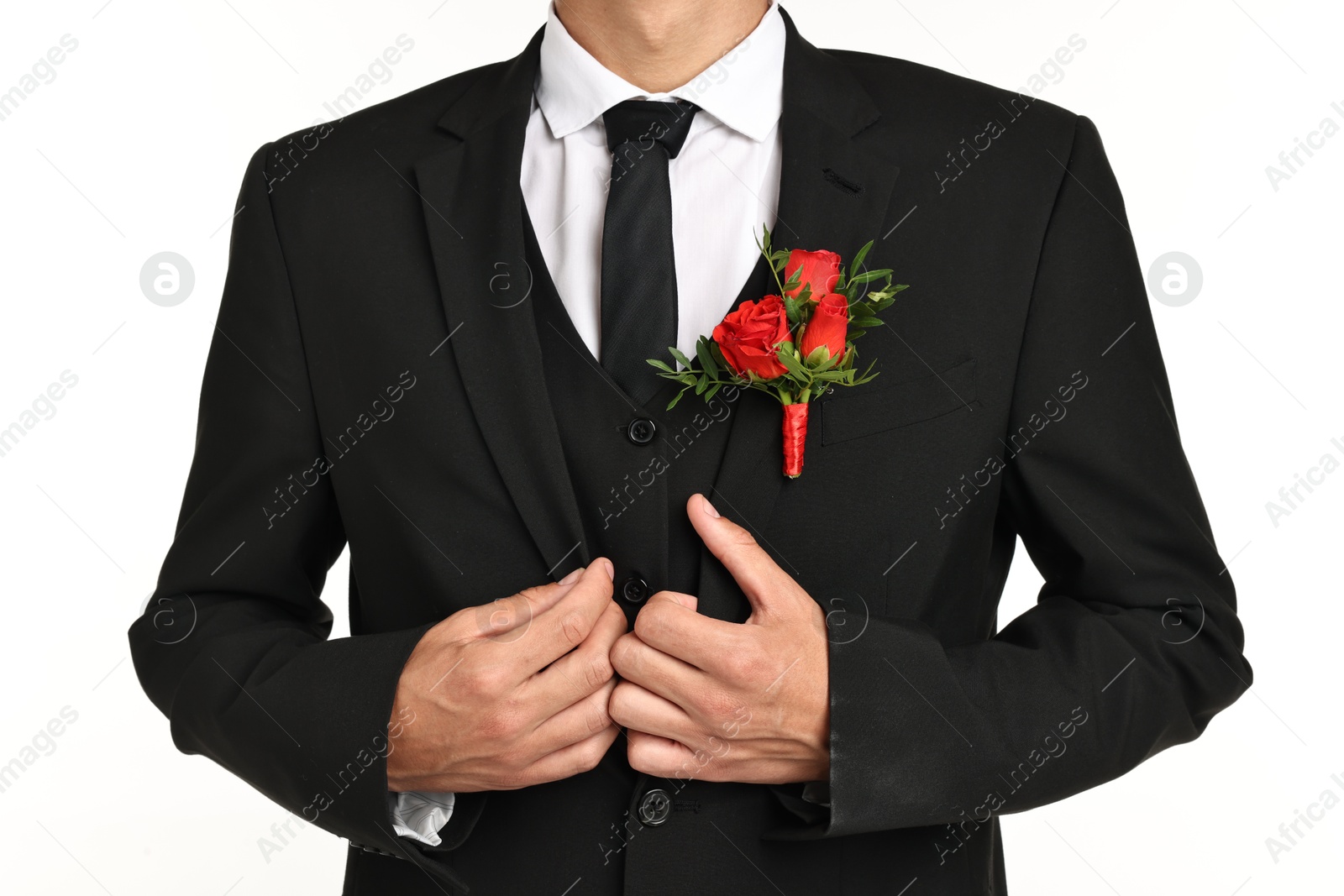 Photo of Groom in suit with stylish boutonniere on white background, closeup