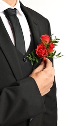 Photo of Groom in suit with stylish boutonniere on white background, closeup