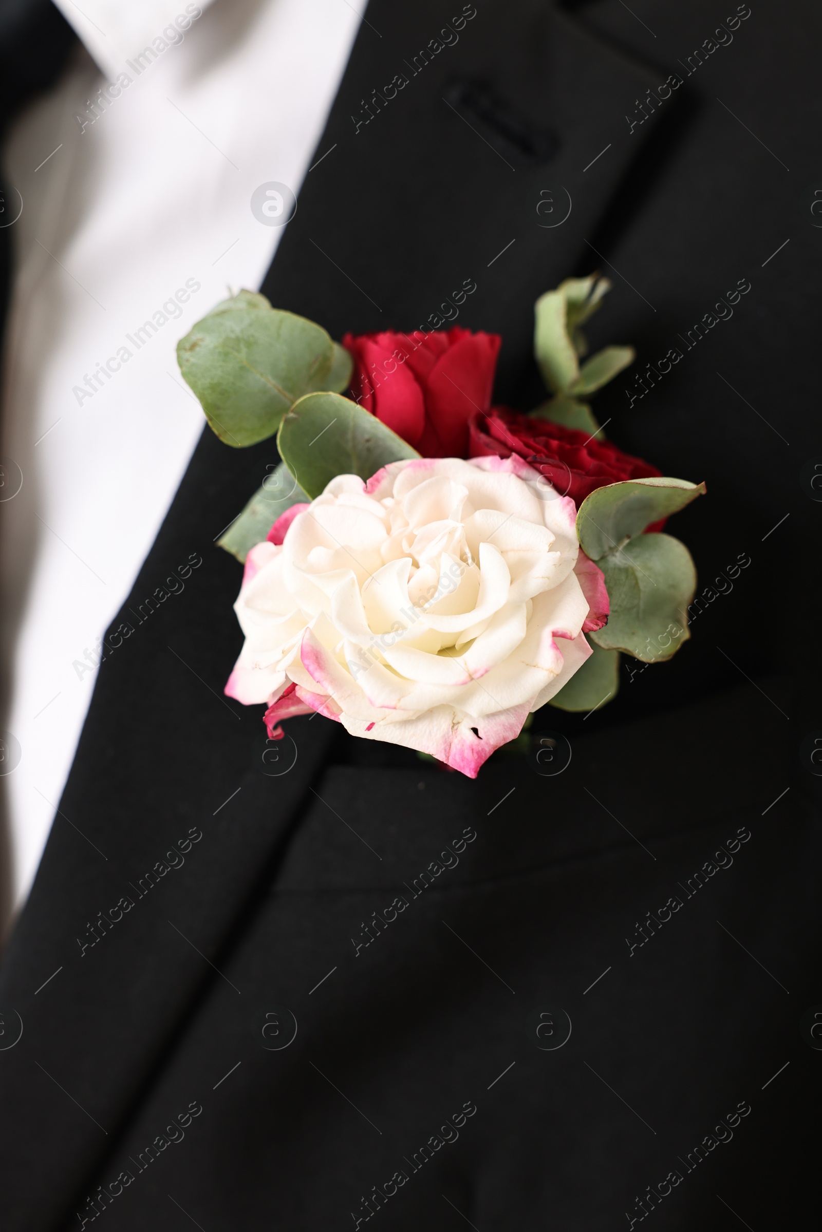 Photo of Groom in suit with stylish boutonniere, closeup