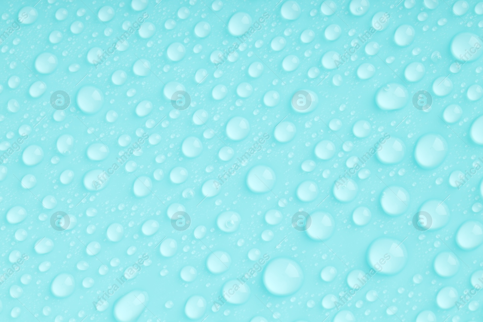 Photo of Water drops on turquoise background, top view