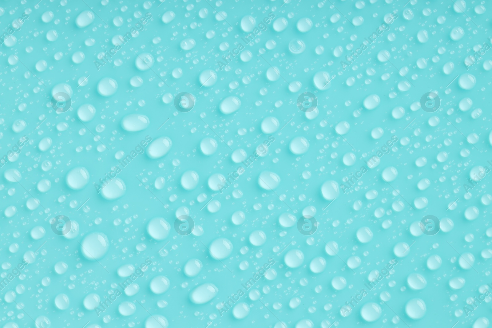 Photo of Water drops on turquoise background, top view