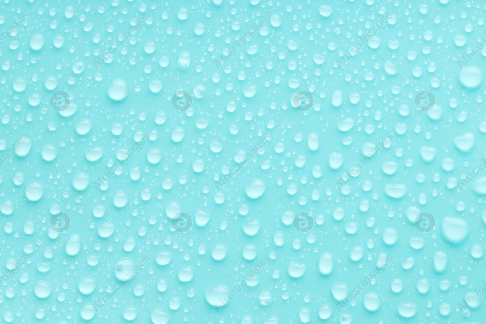 Photo of Water drops on turquoise background, top view