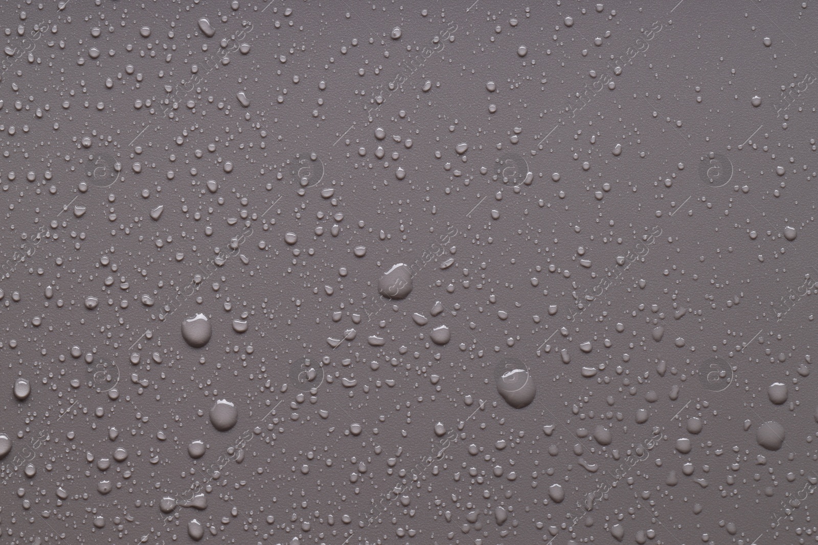 Photo of Water drops on gray background, top view