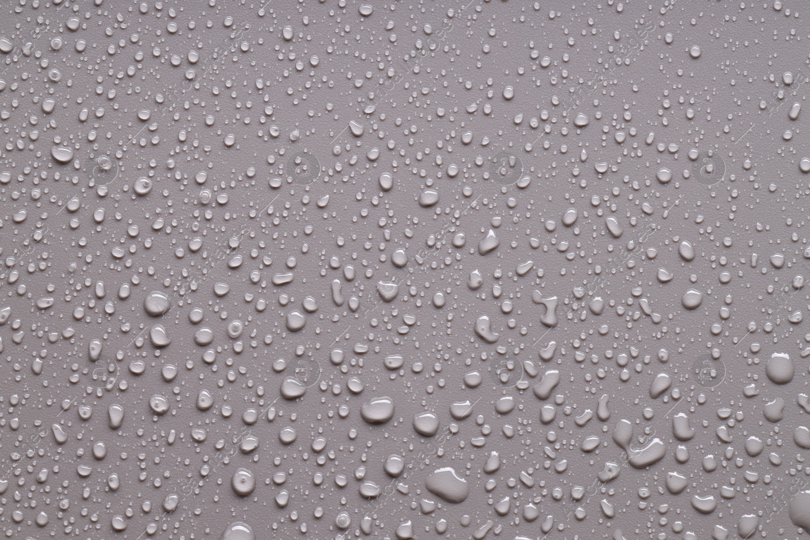 Photo of Water drops on gray background, top view