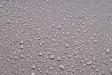 Photo of Water drops on gray background, top view