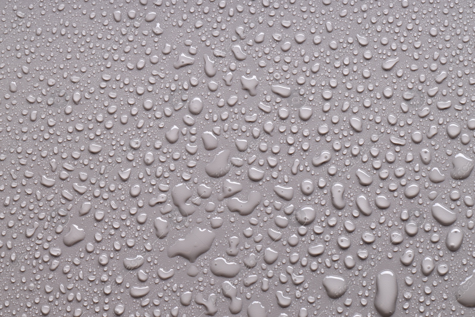 Photo of Water drops on gray background, top view