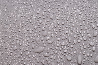 Photo of Water drops on gray background, top view