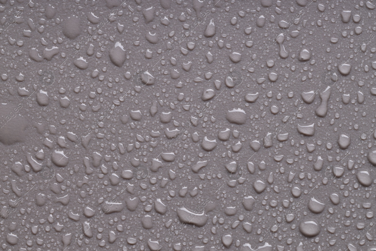 Photo of Water drops on gray background, top view