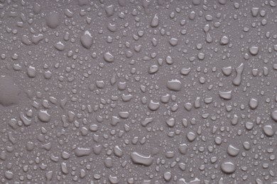 Photo of Water drops on gray background, top view