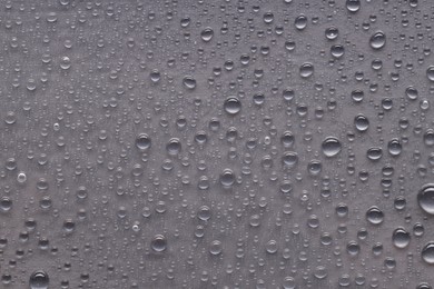 Photo of Water drops on gray background, top view