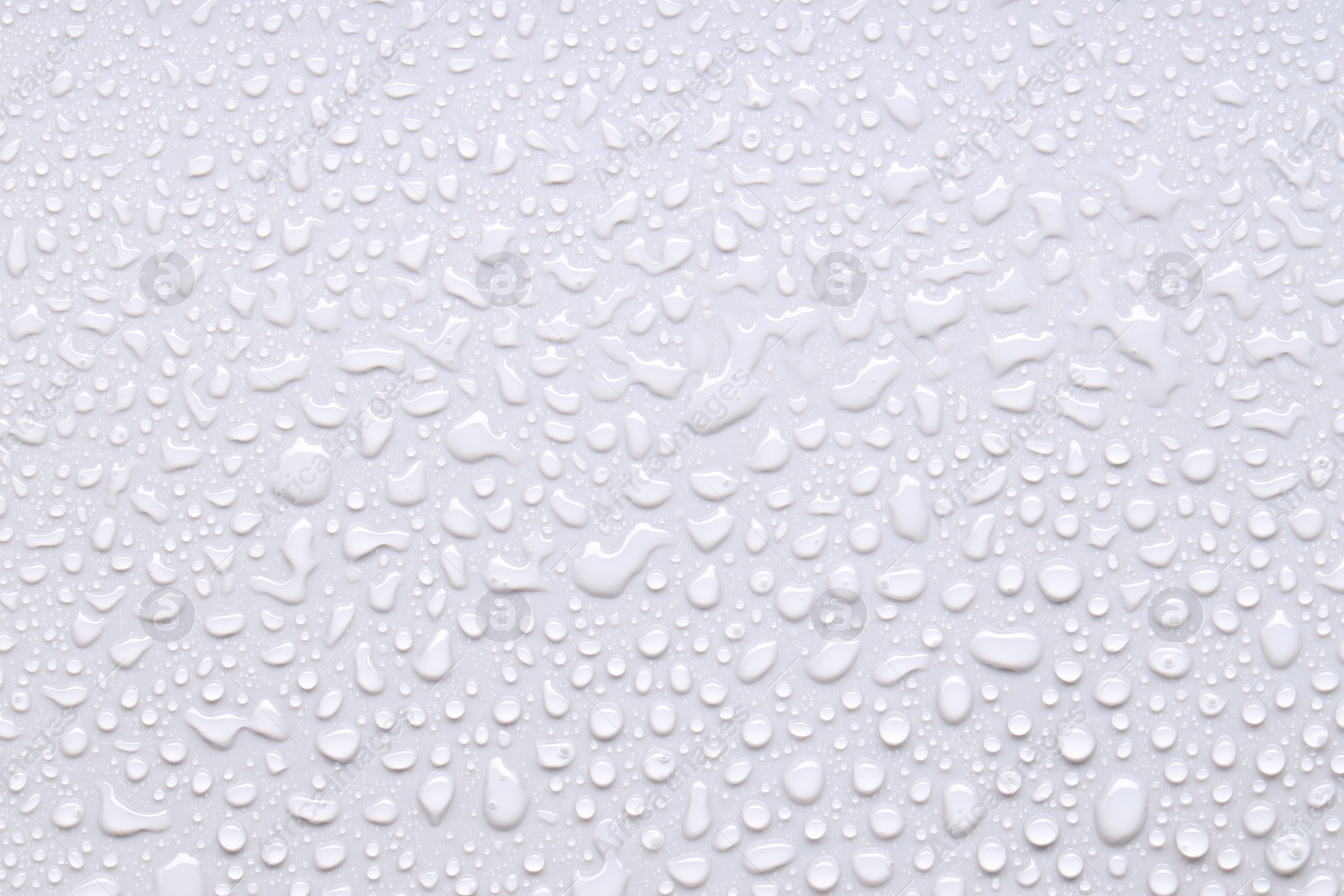 Photo of Water drops on light gray background, top view