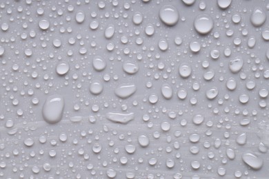 Photo of Water drops on gray background, top view