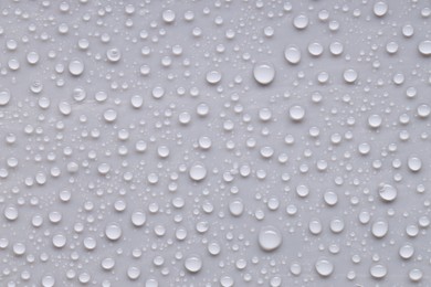 Photo of Water drops on gray background, top view