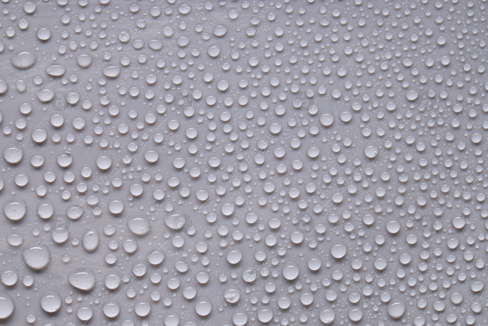 Photo of Water drops on gray background, top view