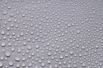 Photo of Water drops on gray background, top view