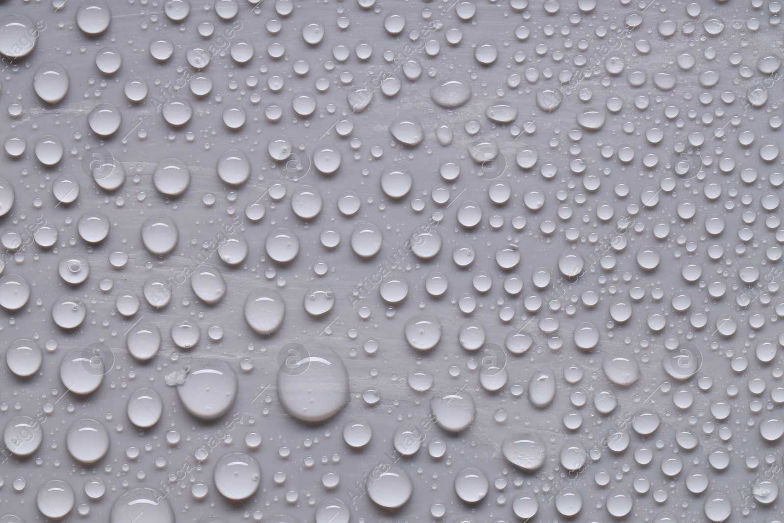 Photo of Water drops on gray background, top view