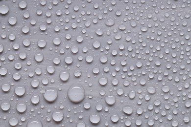 Photo of Water drops on gray background, top view