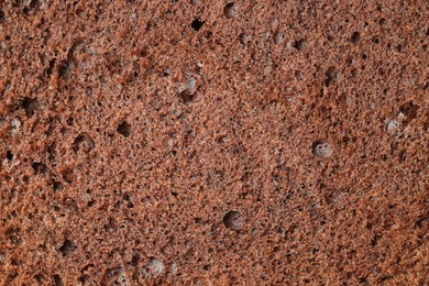 Photo of Tasty chocolate sponge cake as background, closeup