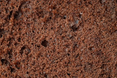 Photo of Tasty chocolate sponge cake as background, closeup