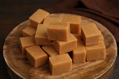 Photo of Tasty sweet caramel candies on table, closeup