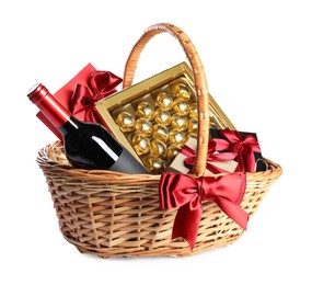 Photo of Wicker gift basket with wine isolated on white