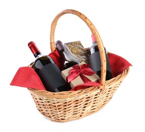 Photo of Wicker gift basket with wine isolated on white