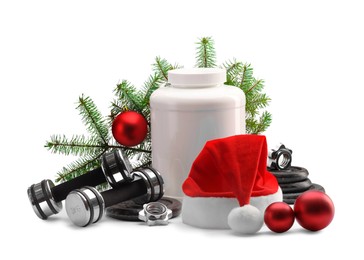 Photo of Dumbbells, container with supplement and Christmas decor isolated on white