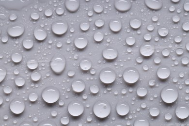 Photo of Water drops on gray background, top view