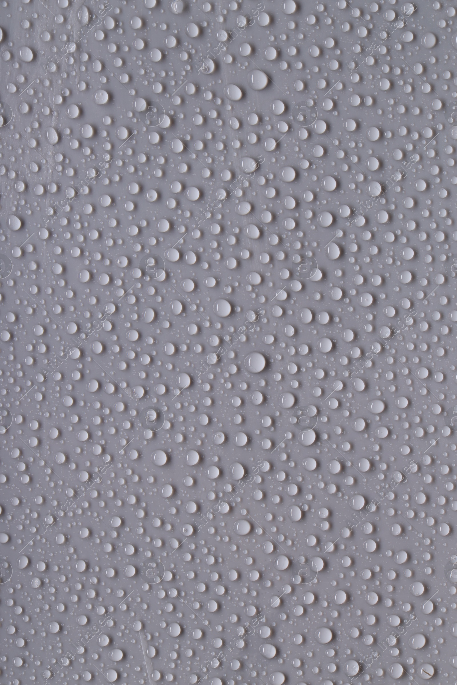 Photo of Water drops on gray background, top view