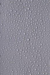 Photo of Water drops on gray background, top view