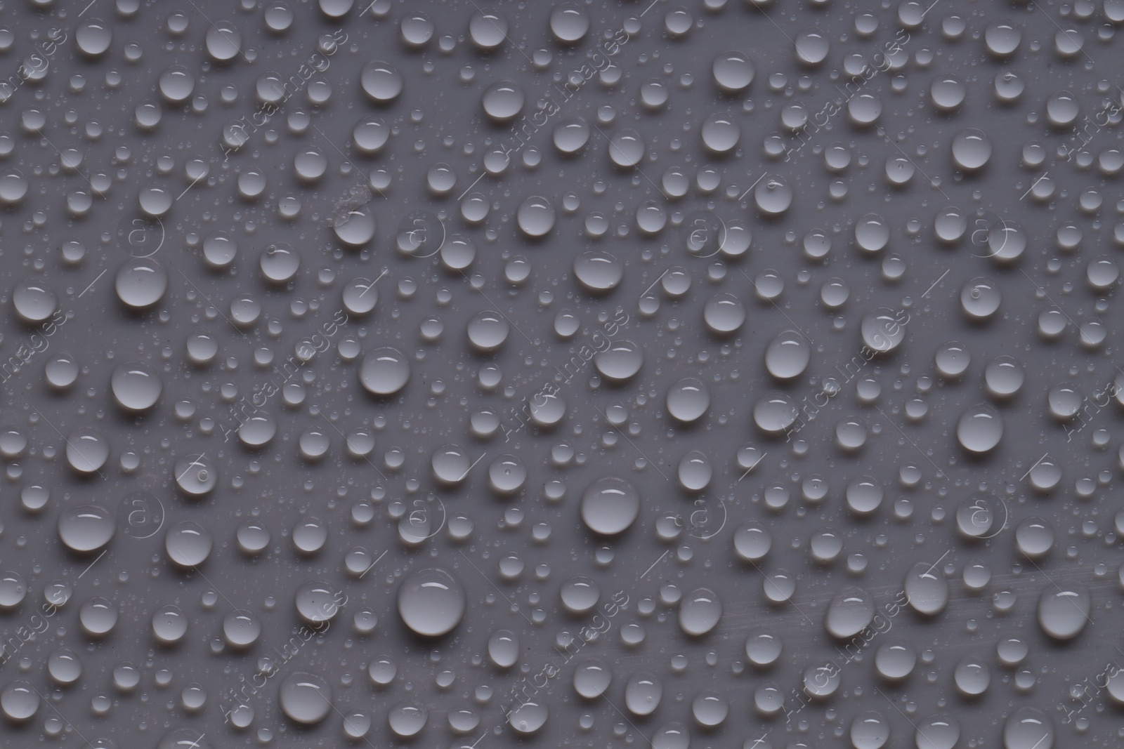 Photo of Water drops on gray background, top view