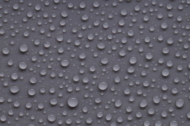 Photo of Water drops on gray background, top view