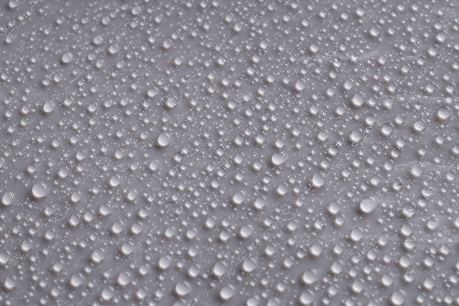 Photo of Water drops on gray background, top view