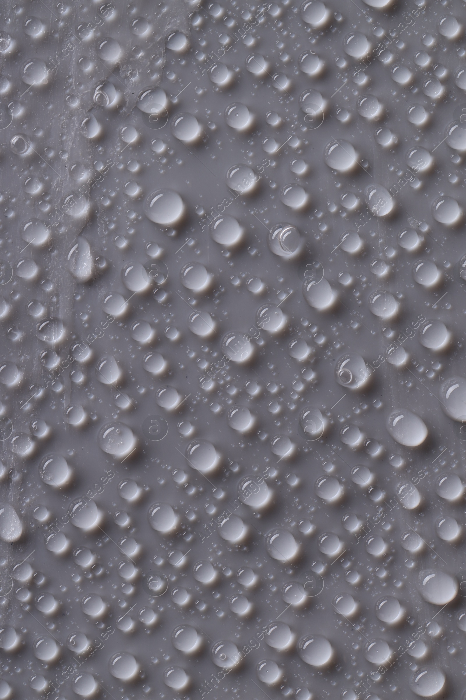 Photo of Water drops on gray background, top view