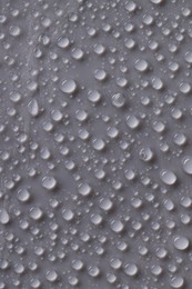 Photo of Water drops on gray background, top view