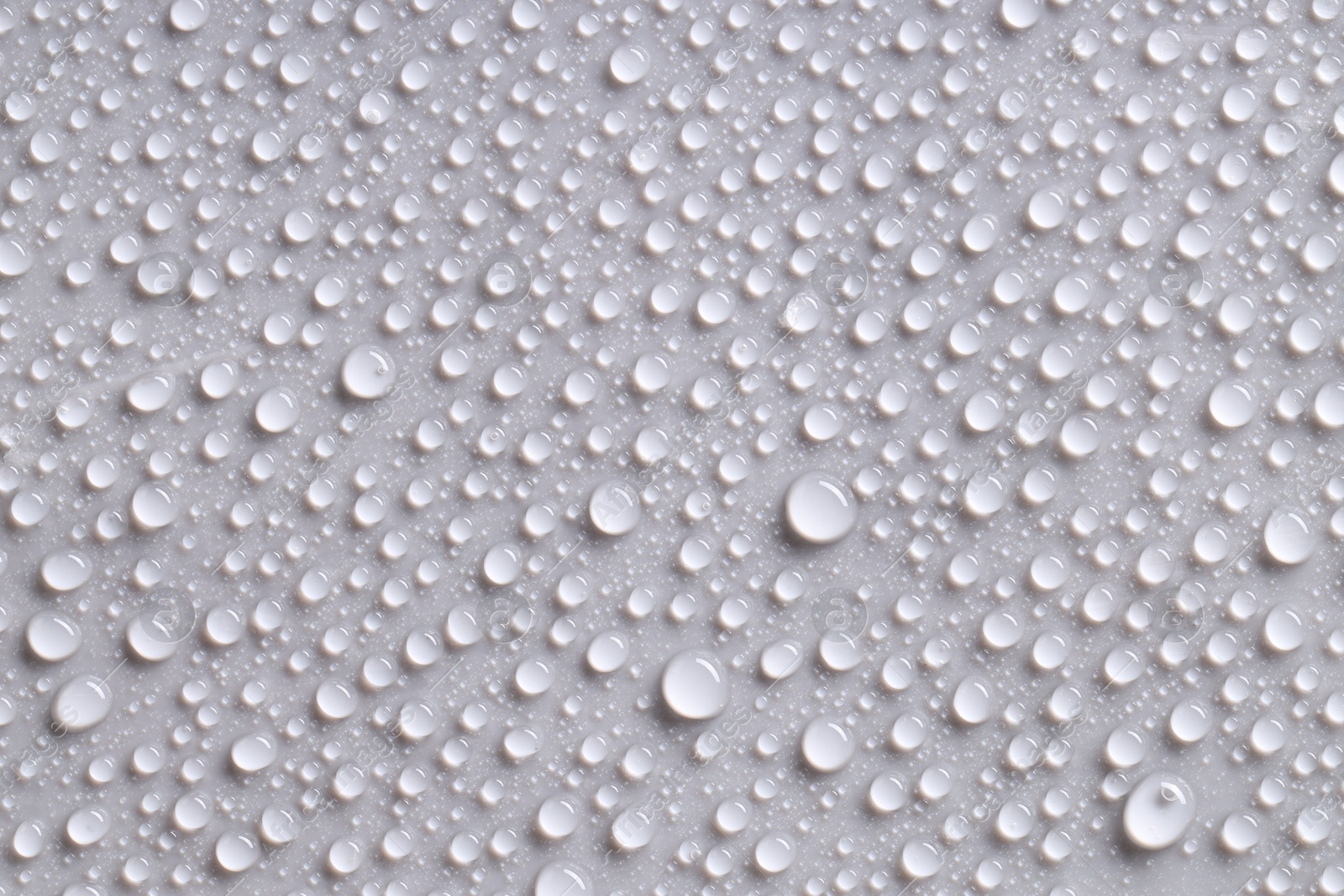 Photo of Water drops on gray background, top view