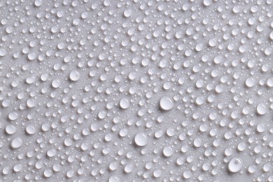 Photo of Water drops on gray background, top view