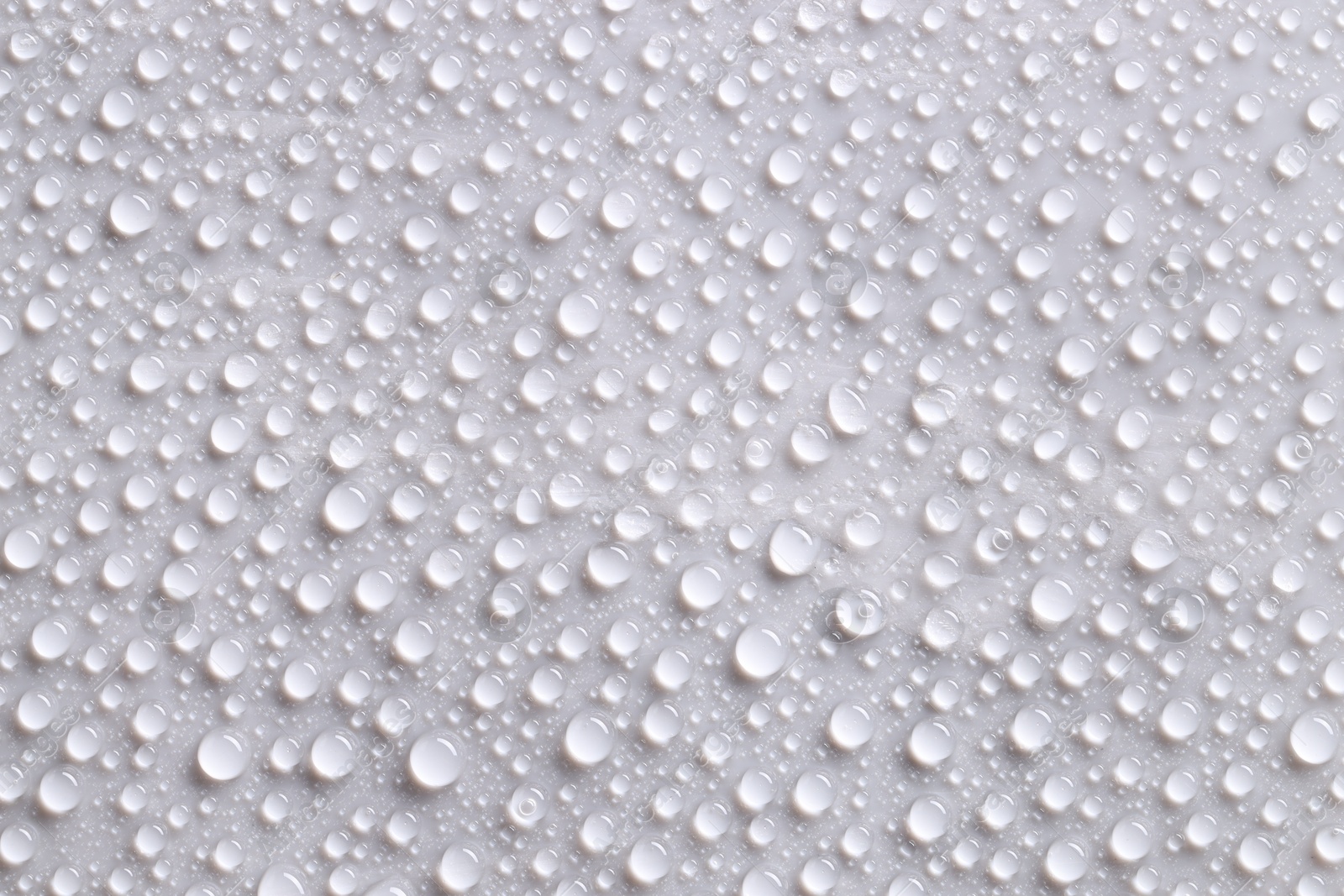 Photo of Water drops on gray background, top view