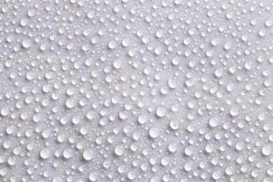 Photo of Water drops on gray background, top view