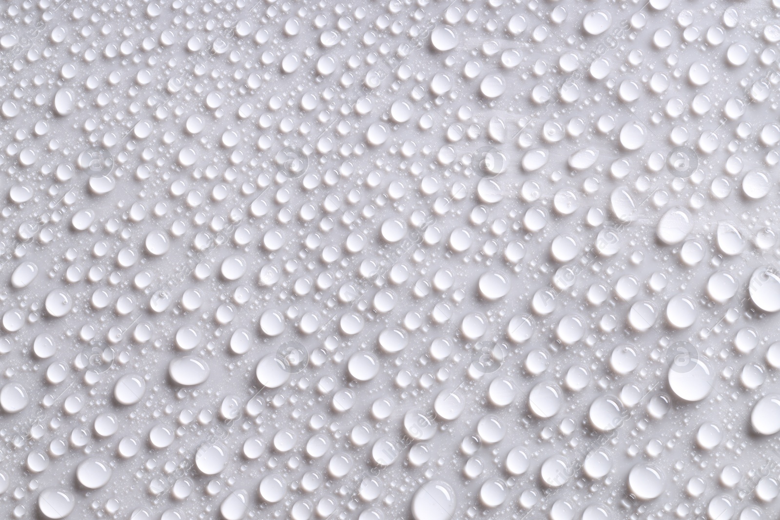 Photo of Water drops on gray background, top view