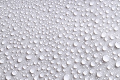 Photo of Water drops on gray background, top view