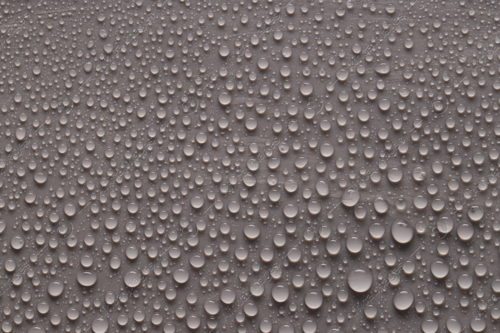 Photo of Water drops on gray background, top view