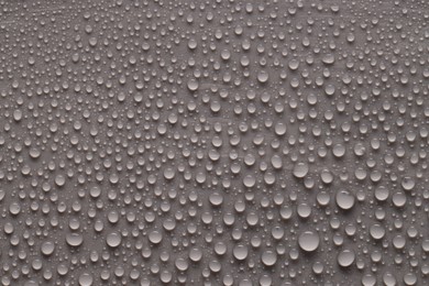 Photo of Water drops on gray background, top view