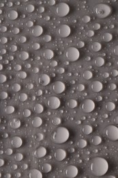 Photo of Water drops on gray background, top view