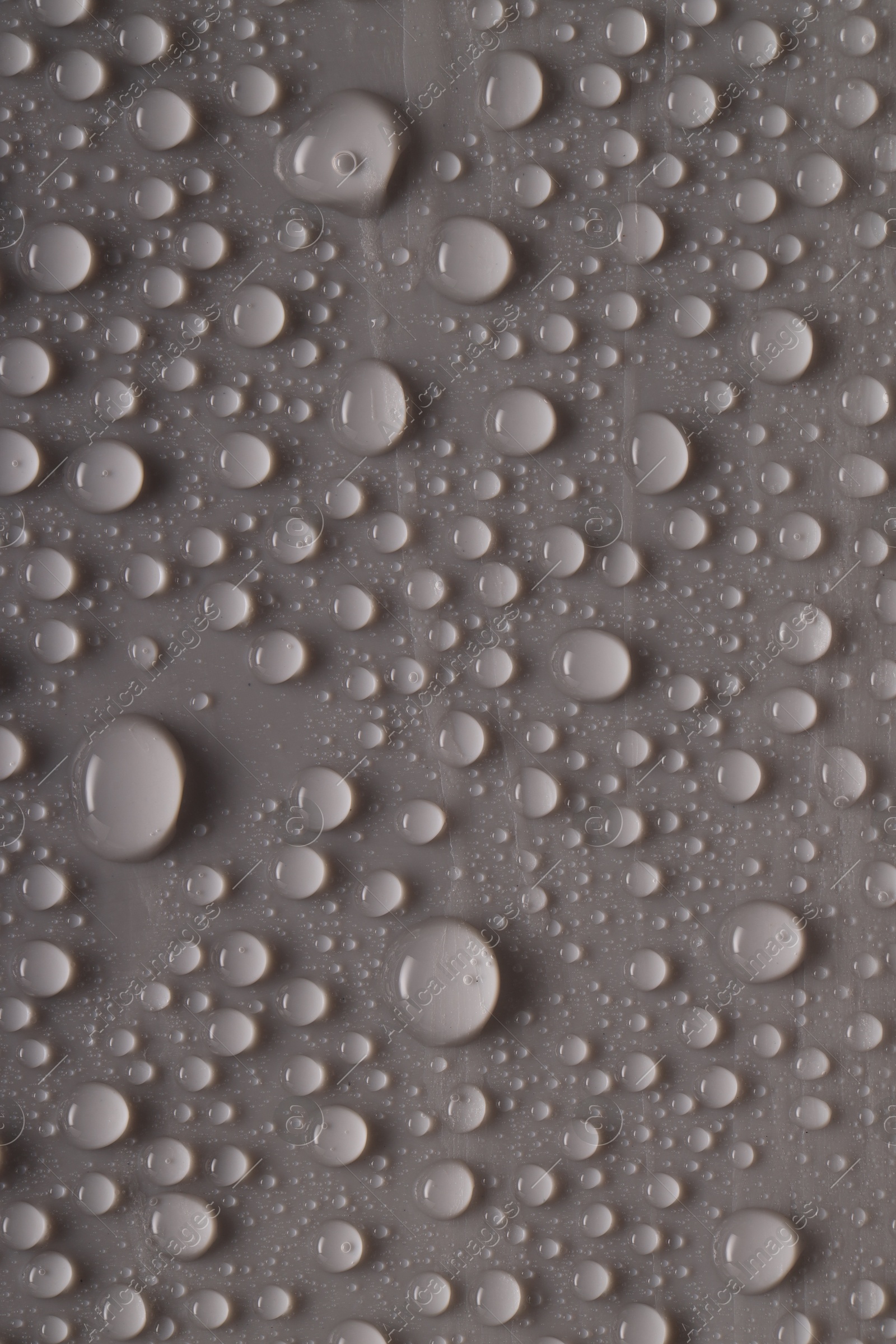 Photo of Water drops on gray background, top view