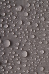 Photo of Water drops on gray background, top view