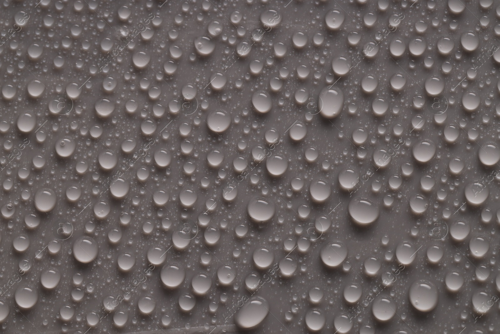 Photo of Water drops on gray background, top view