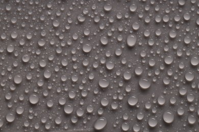 Photo of Water drops on gray background, top view